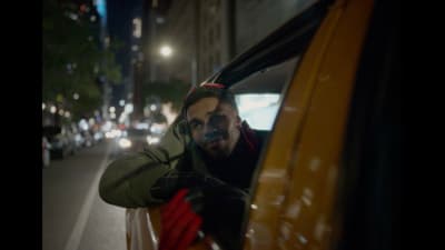 a man with his head out of a car window