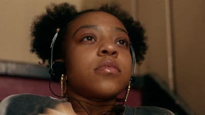 a woman wearing a headset and looking up