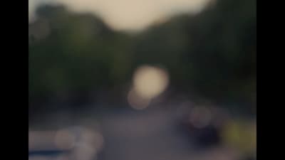 a blurry picture of a street with cars on it