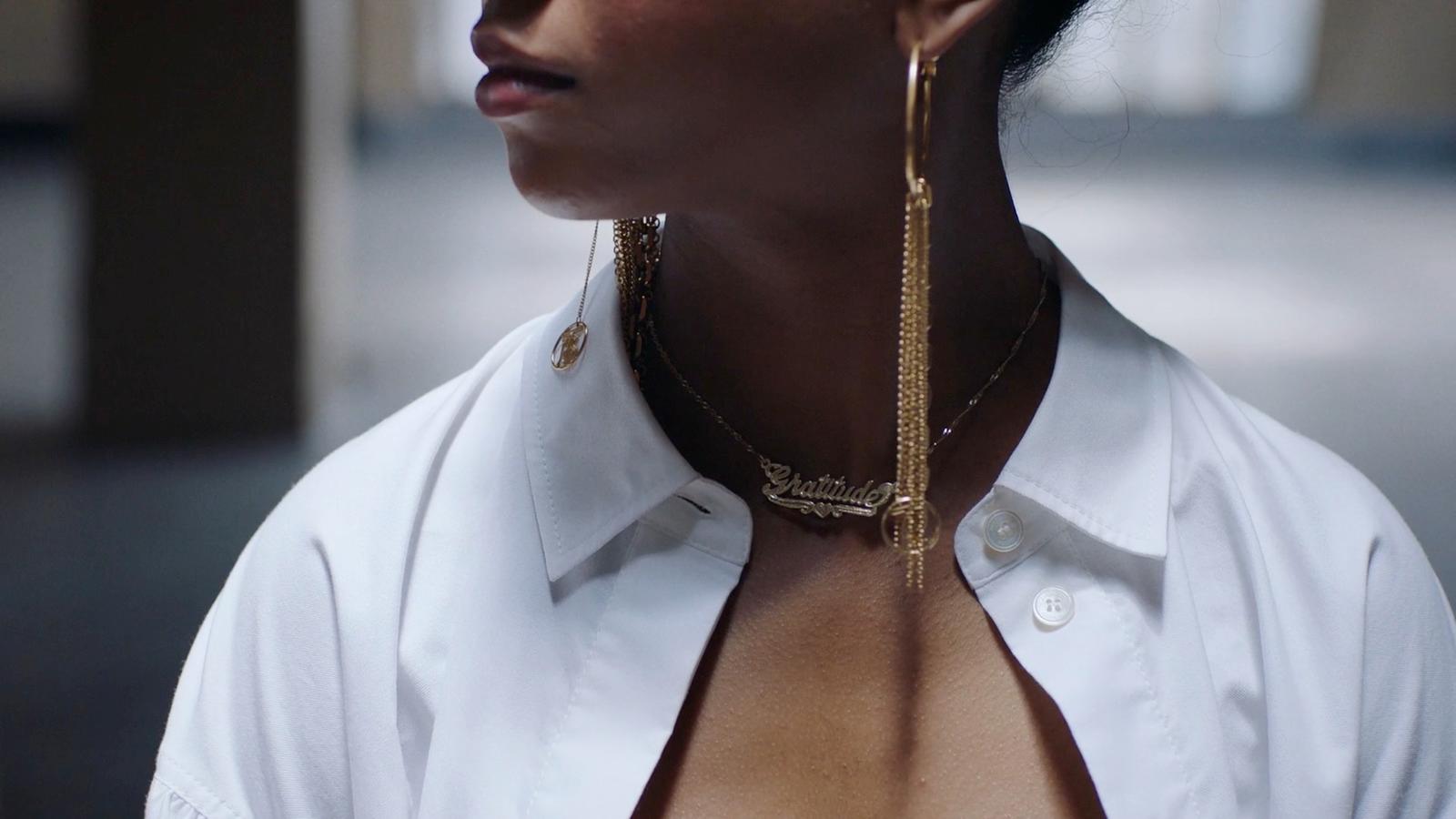 a close up of a person wearing a white shirt