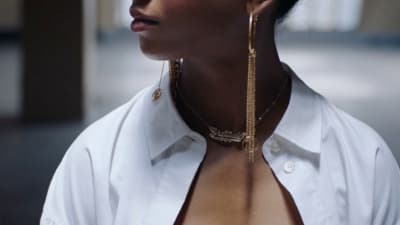 a close up of a person wearing a white shirt
