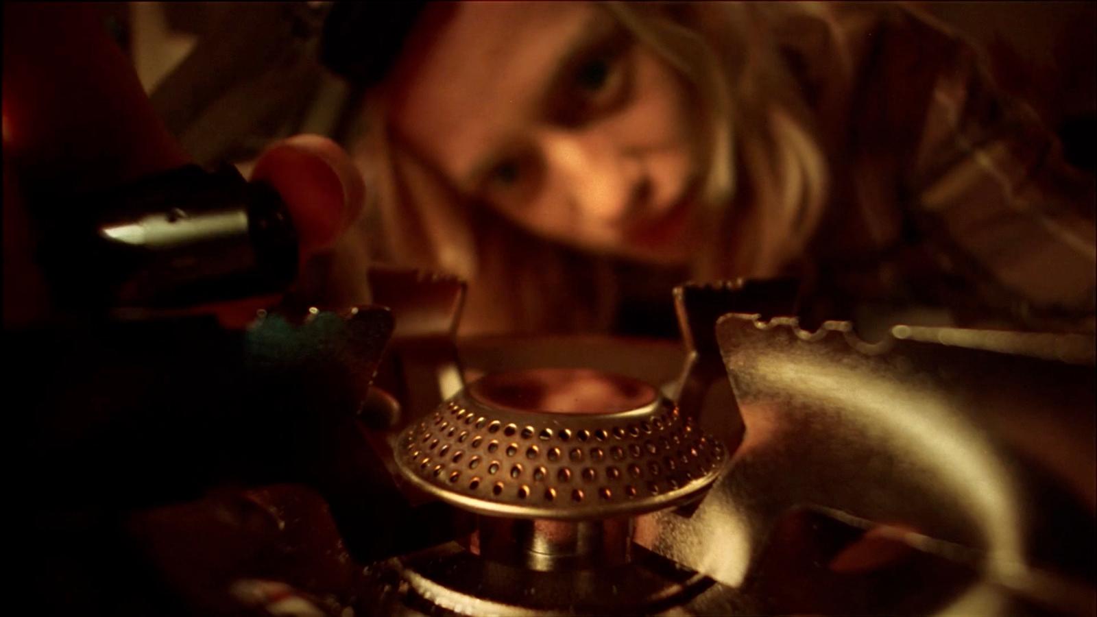 a close up of a person operating a stove