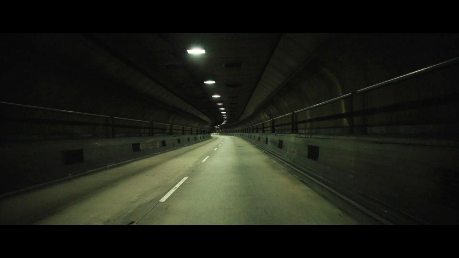 a dark tunnel with a light at the end