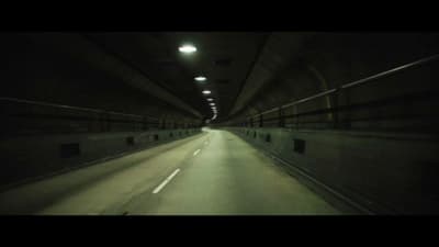 a dark tunnel with a light at the end