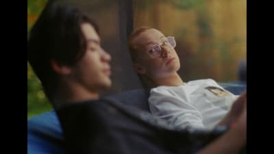 a man and a woman laying down next to each other
