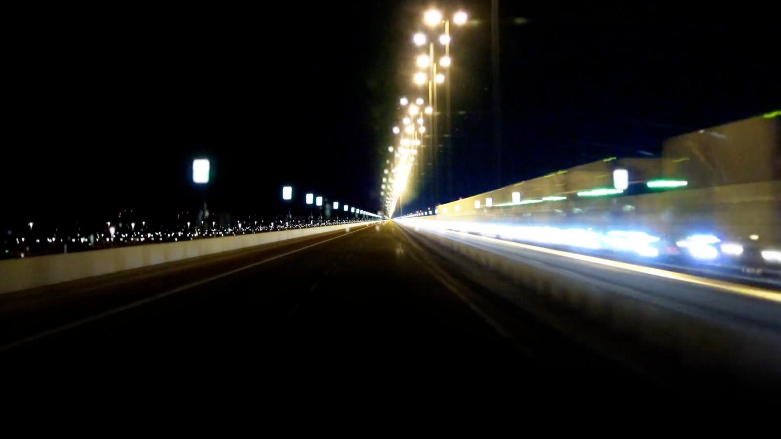 a blurry photo of a city street at night