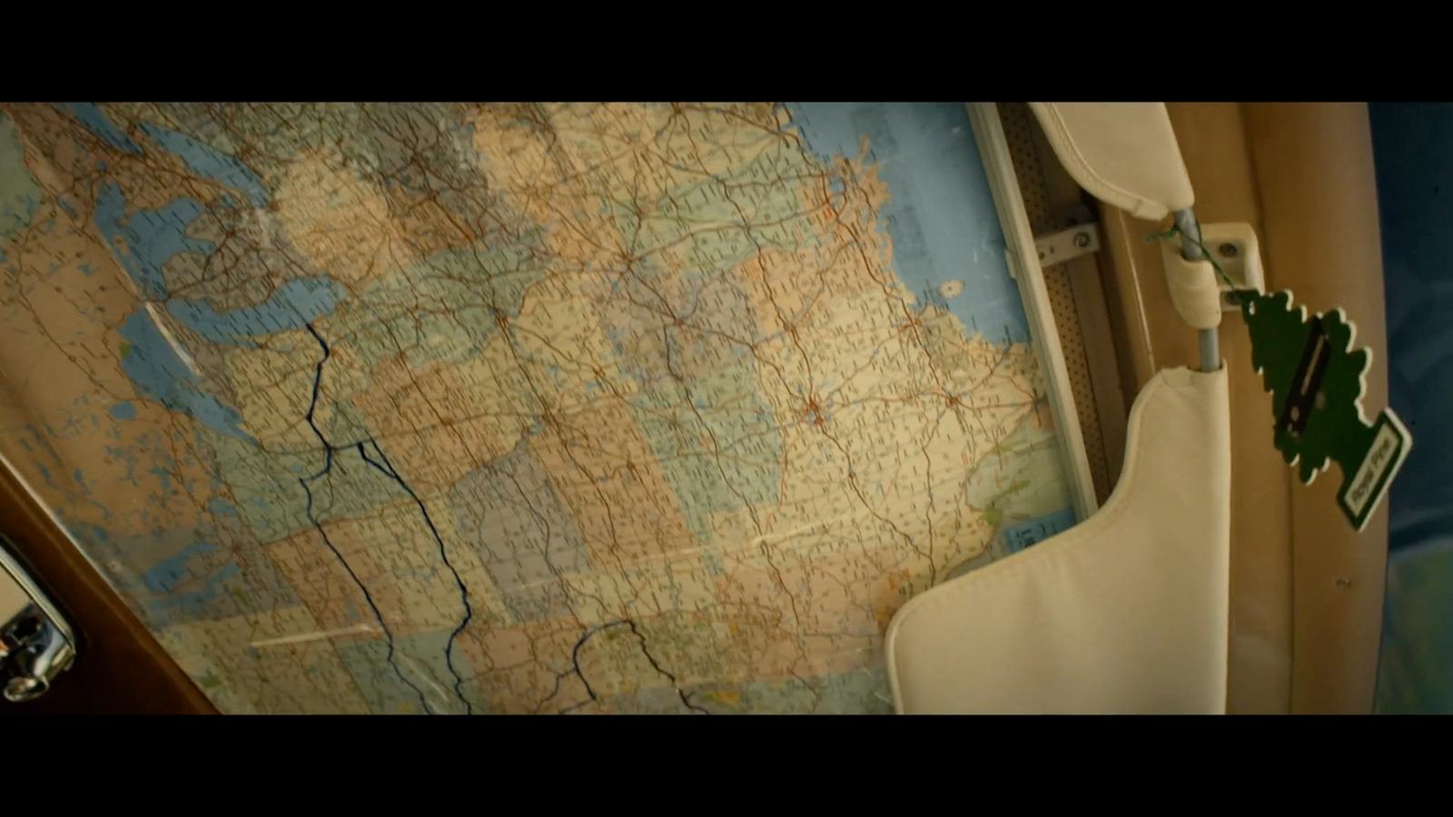 a bathroom with a map on the wall