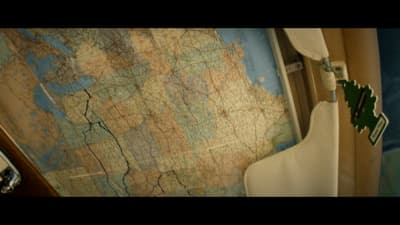 a bathroom with a map on the wall