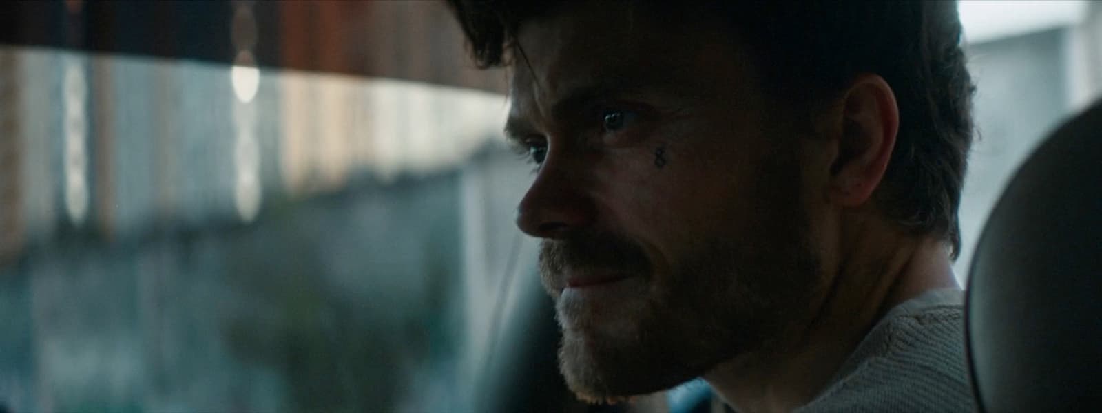 a close up of a person in a car