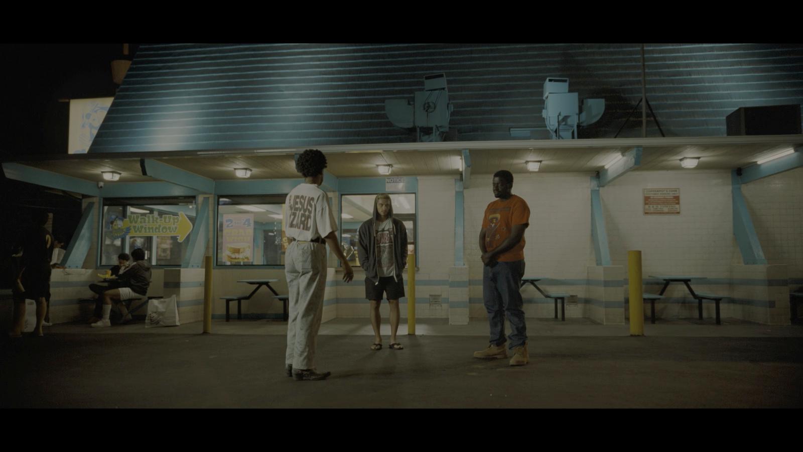 a group of people standing in front of a building