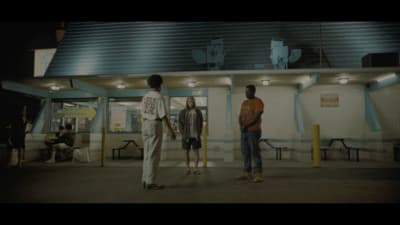 a group of people standing in front of a building
