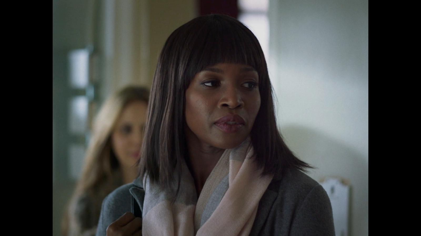 a woman with a scarf around her neck