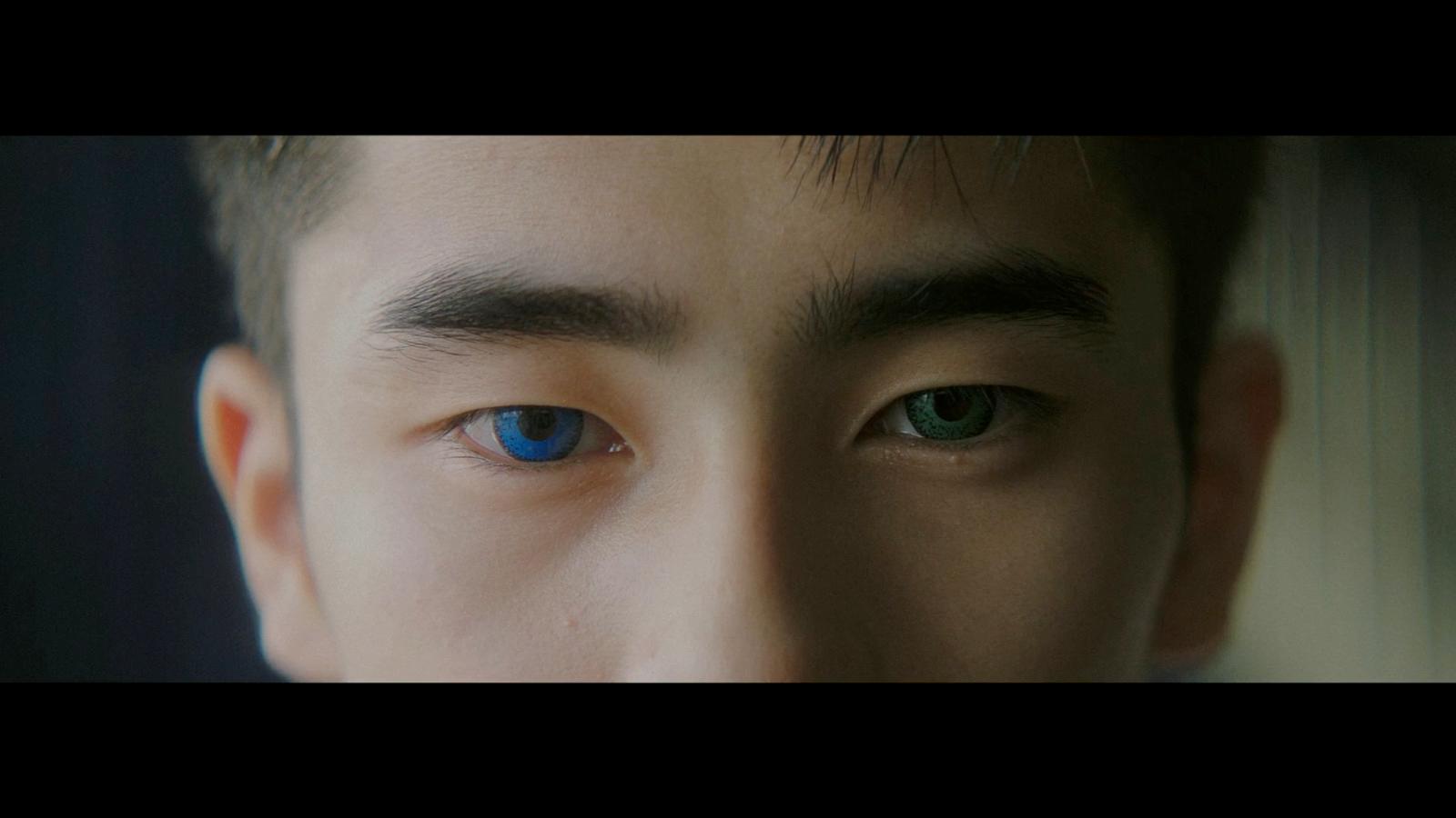 a close up of a person with blue eyes