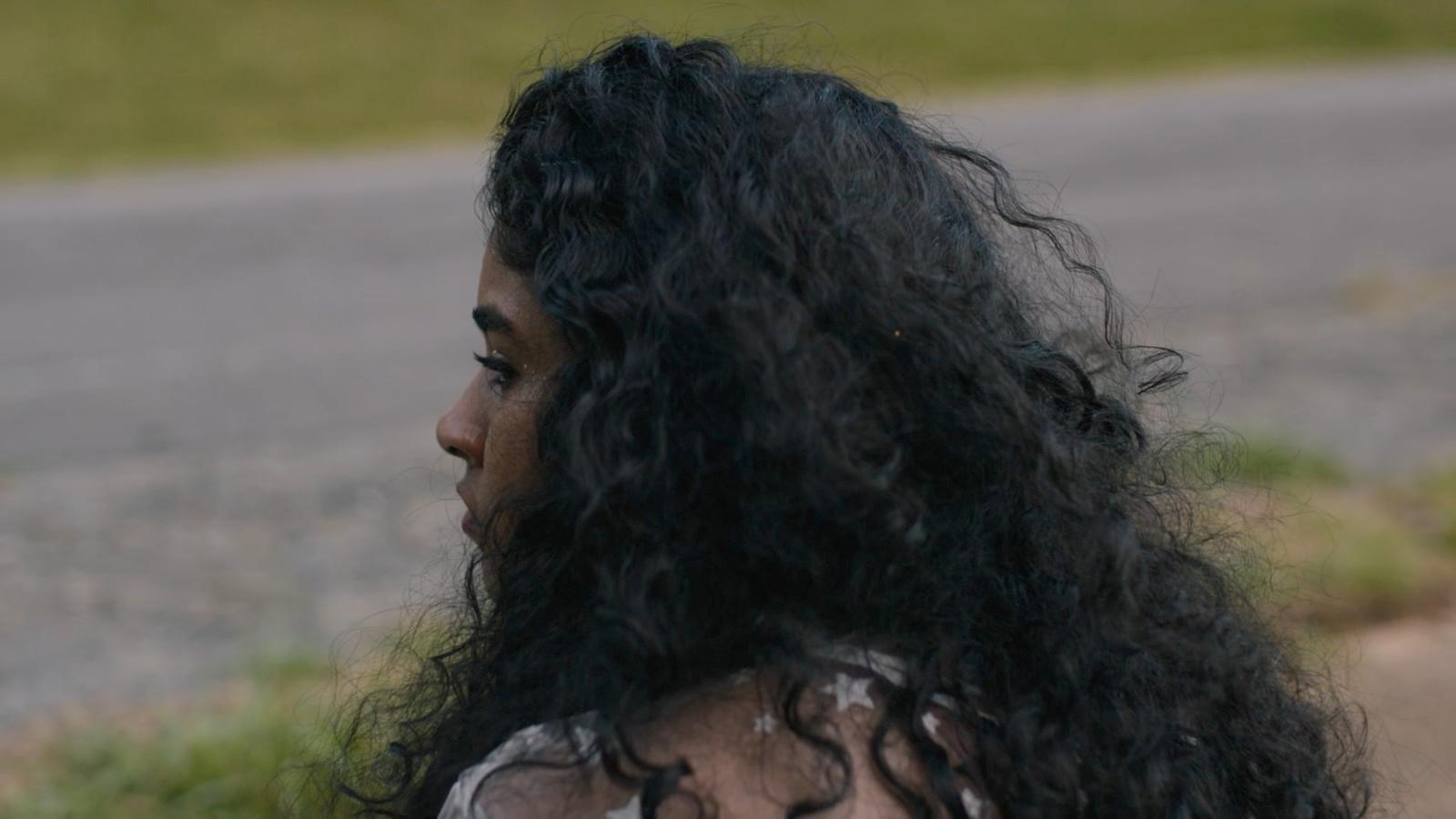a close up of a person with long hair