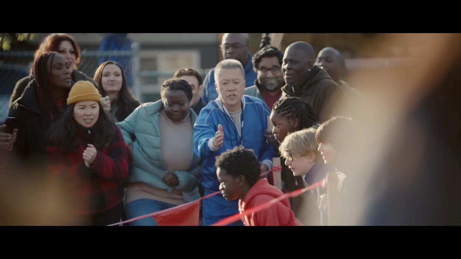 a group of people standing around each other