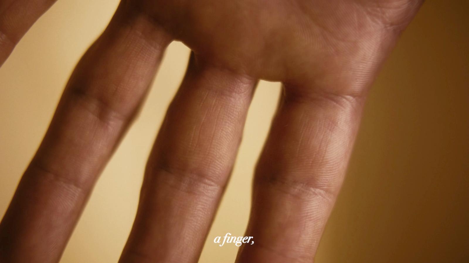 a close up of a person's hand holding a cell phone