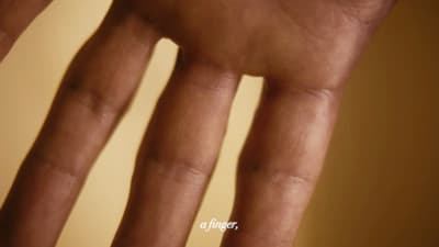 a close up of a person's hand holding a cell phone