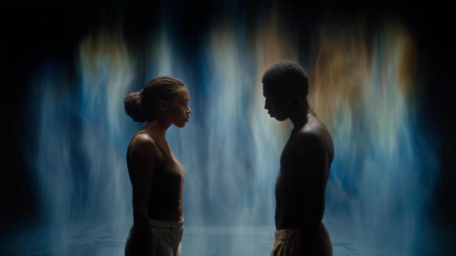 a couple of people standing next to each other