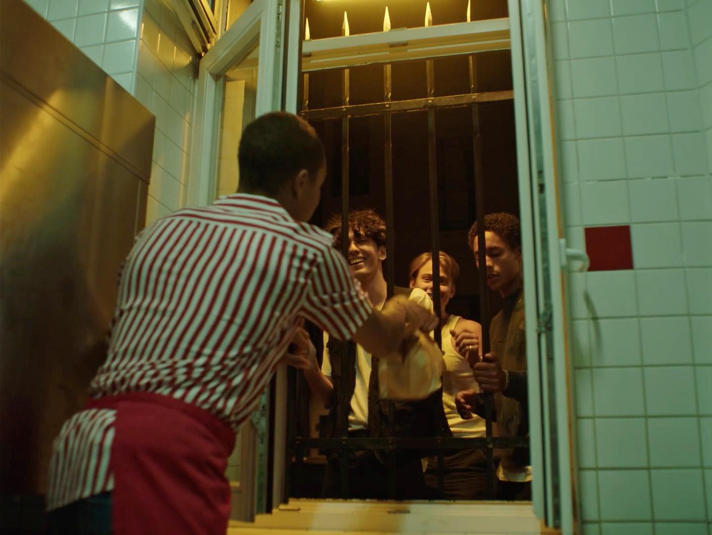 a group of people standing outside of a building
