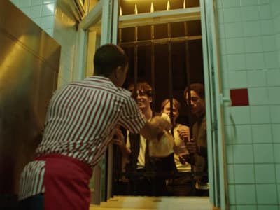a group of people standing outside of a building