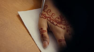 a woman's hand with a henna on it