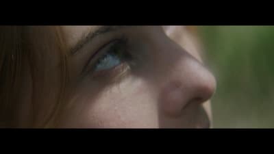 a close up of a person's face with a blurry background