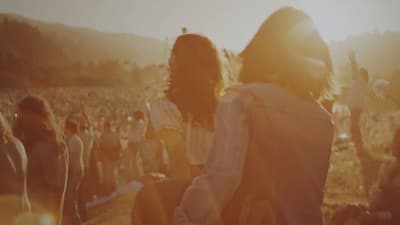 a group of people standing in a field