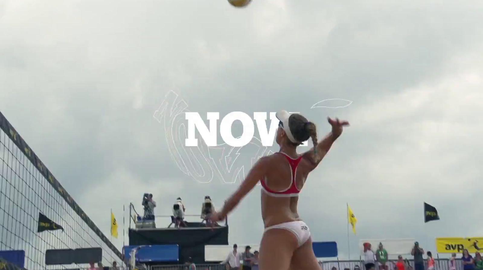 a woman in a bikini playing a game of volleyball