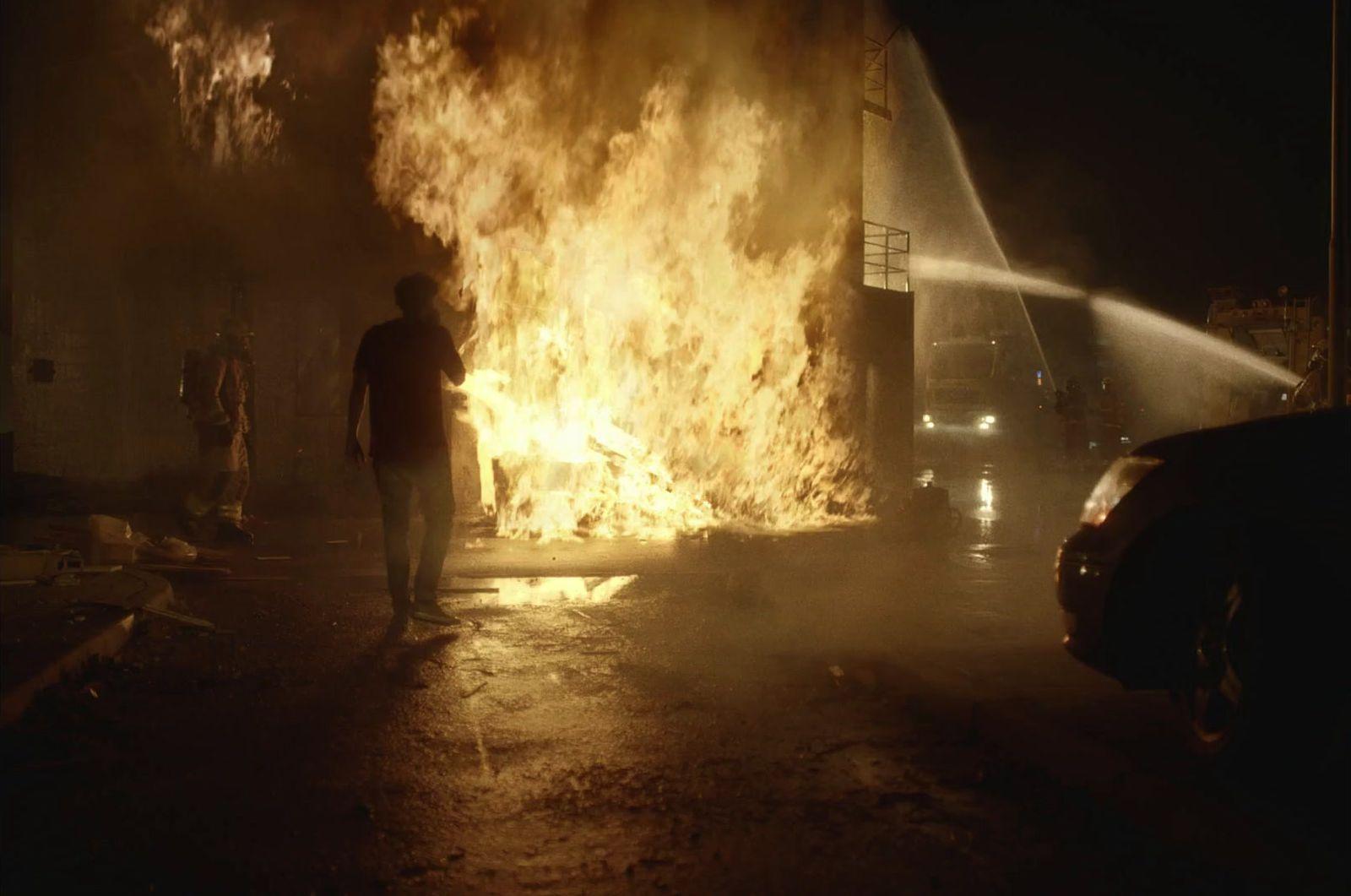 a man standing in front of a fire hydrant