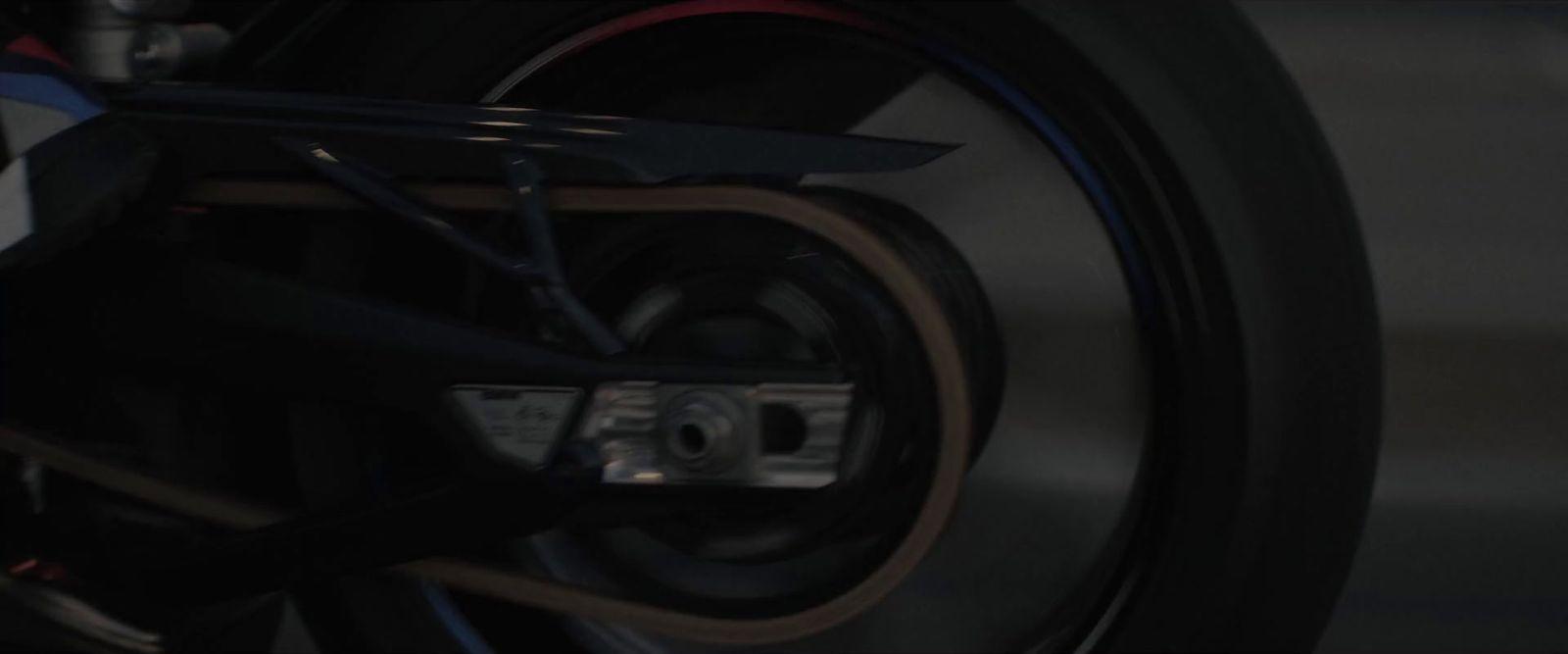 a close up of a motorcycle tire with a clock on it