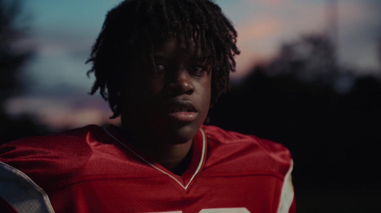 a close up of a person wearing a football uniform