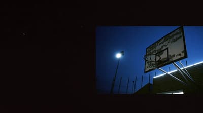 an image of a basketball hoop at night