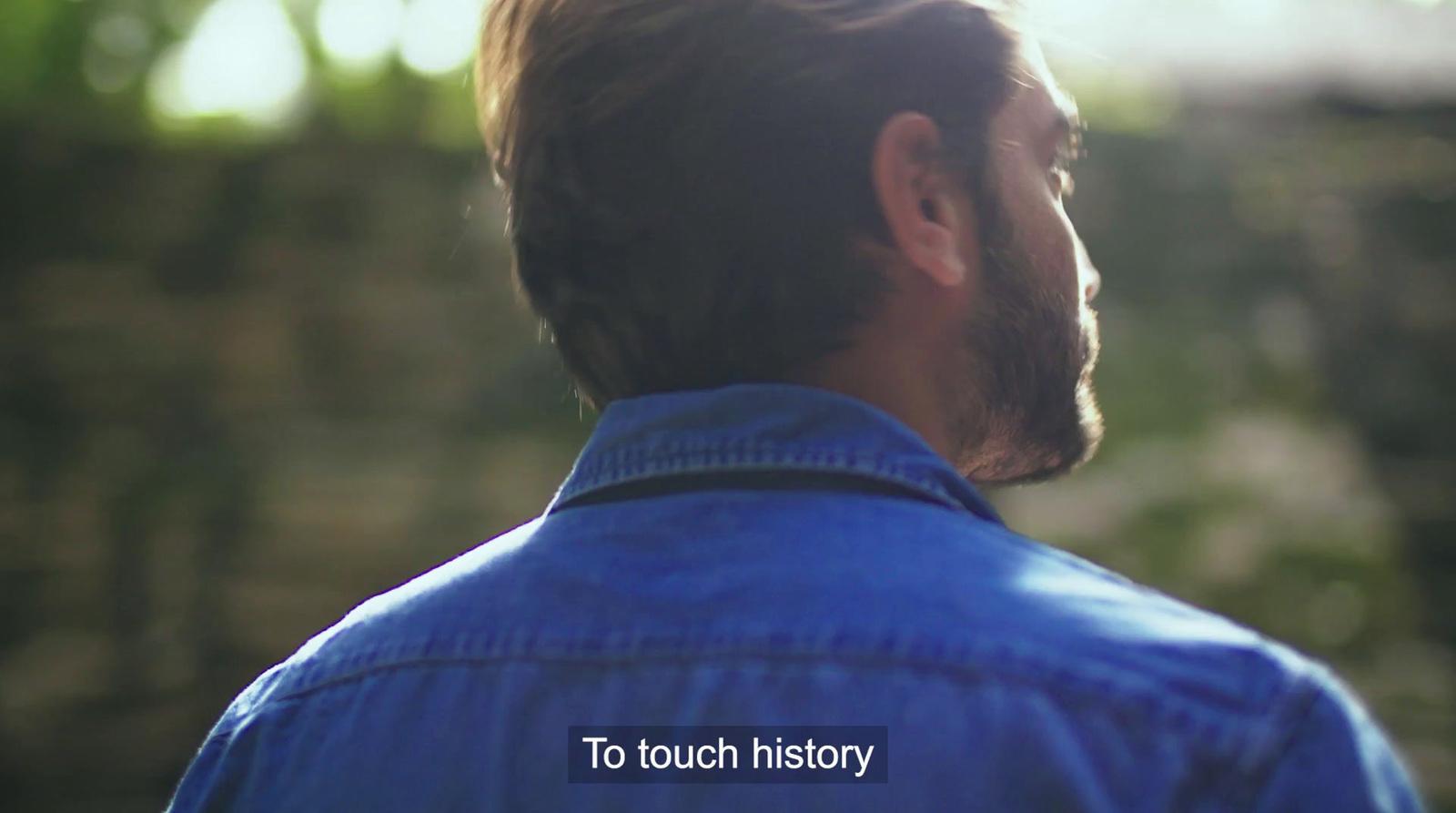a close up of a person wearing a blue shirt
