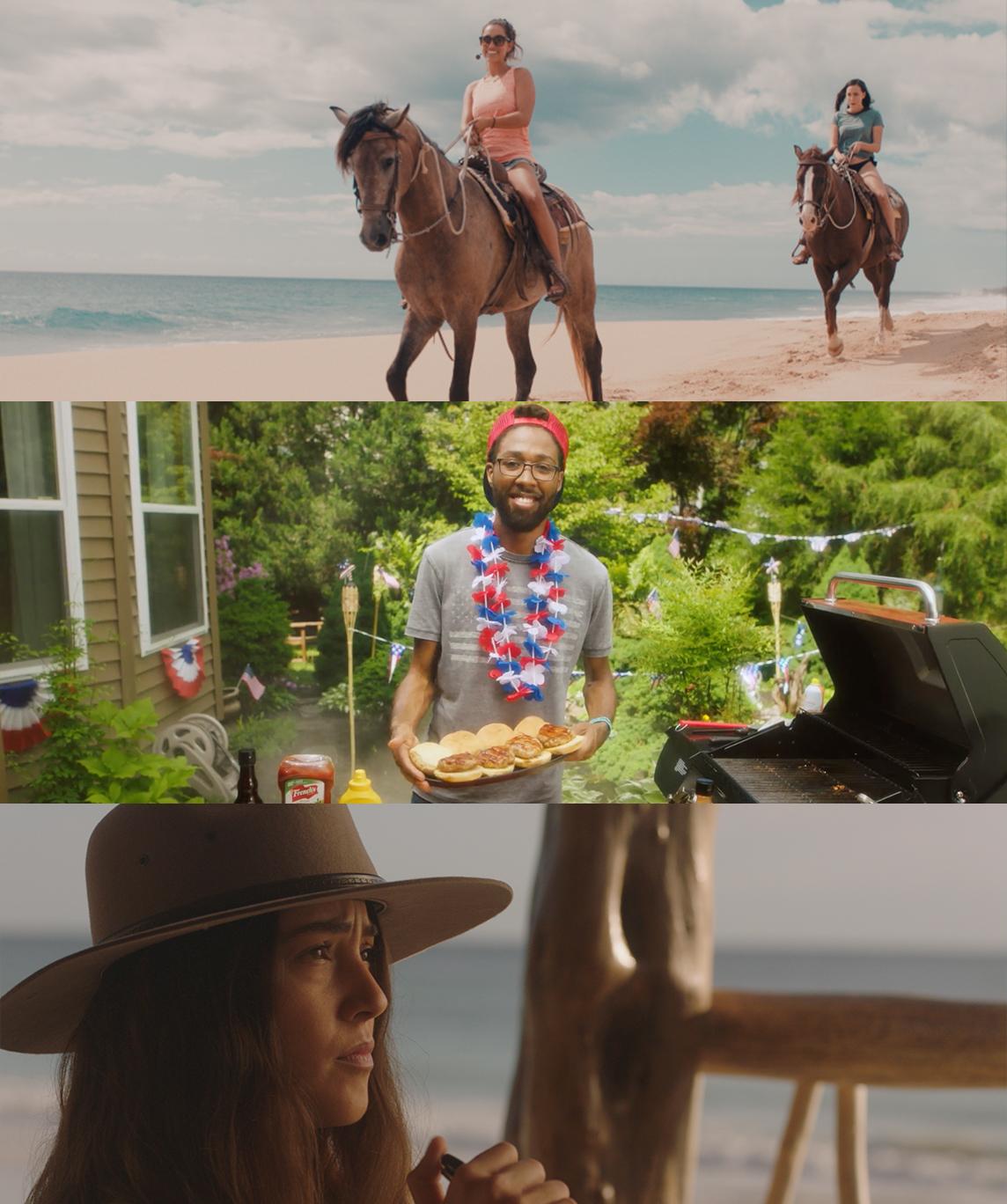 a woman in a hat and a man on a horse on the beach
