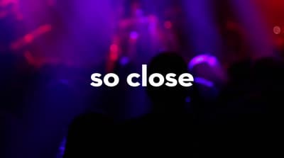 a blurry photo of a concert with the words so close