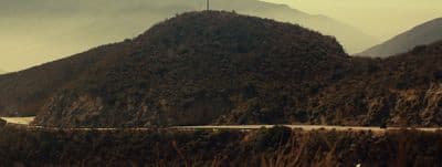 a mountain with a road going through it