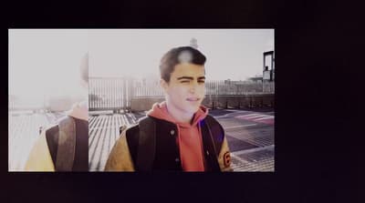 a photo of a young man in a jacket