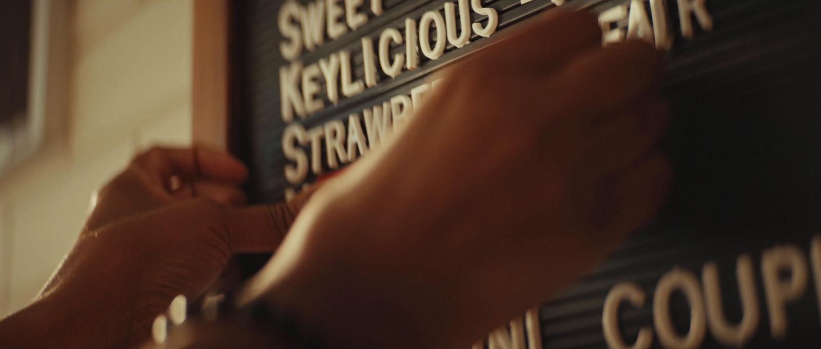 a person writing on a blackboard