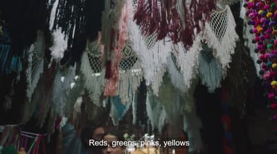 a store with lots of different colored beads hanging from it's ceiling