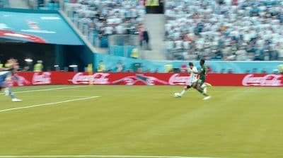 a group of men playing a game of soccer