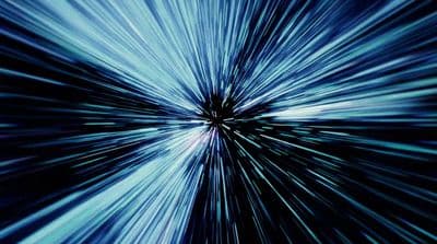 a blue and black background with a star burst