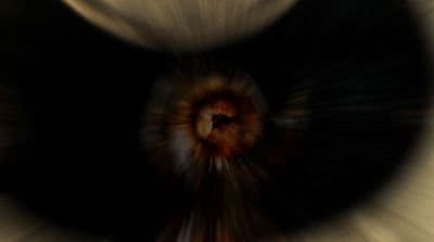 a blurry photo of a black and white object