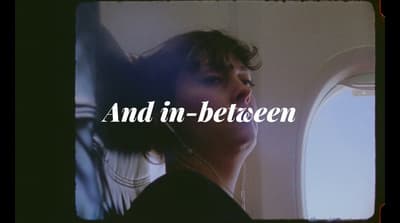 a picture of a woman looking out an airplane window