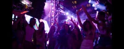 a group of people dancing at a party