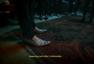 a group of people standing in front of a rug