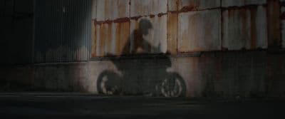 a shadow of a person on a bike