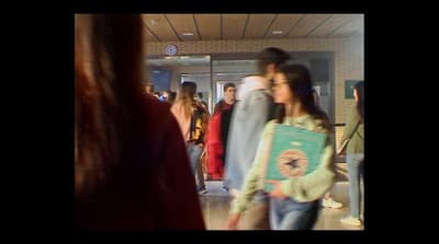 a group of people standing in a hallway