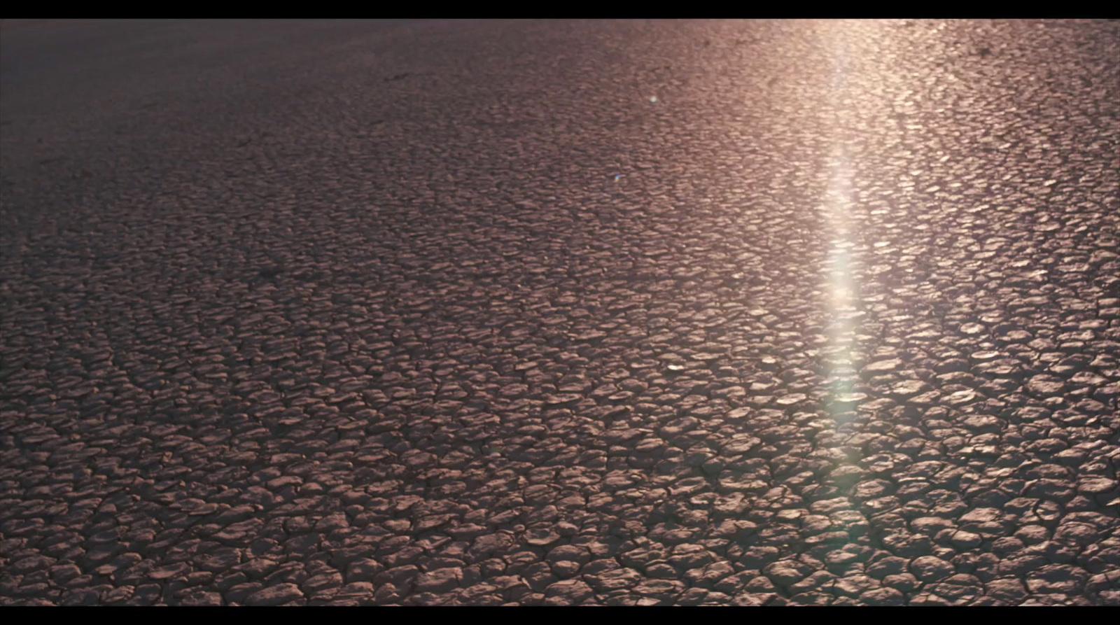 the sun is shining down on the asphalt