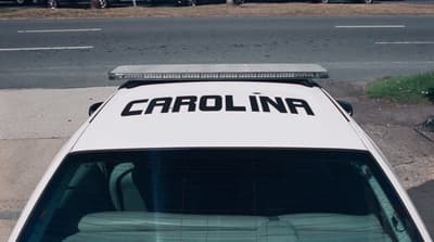 a white car parked on the side of the road