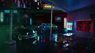 a car parked in a garage with neon lights
